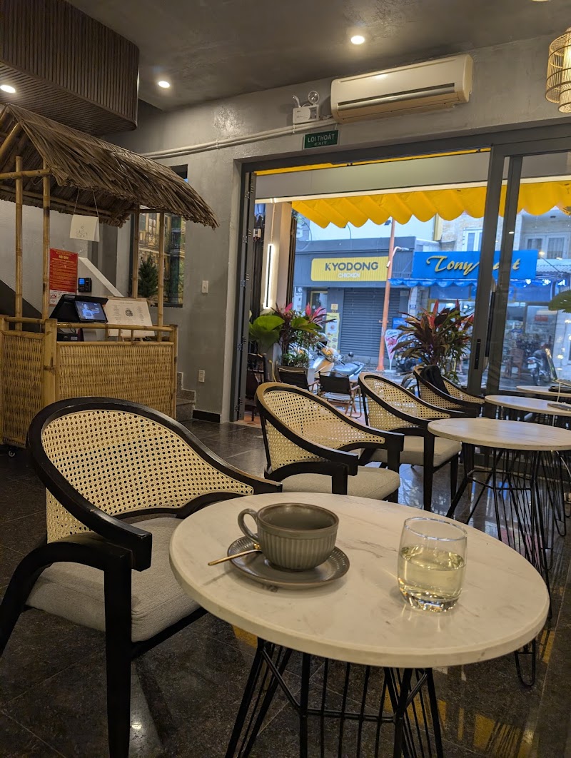 Coffee cup and a glass on a round table near the front window